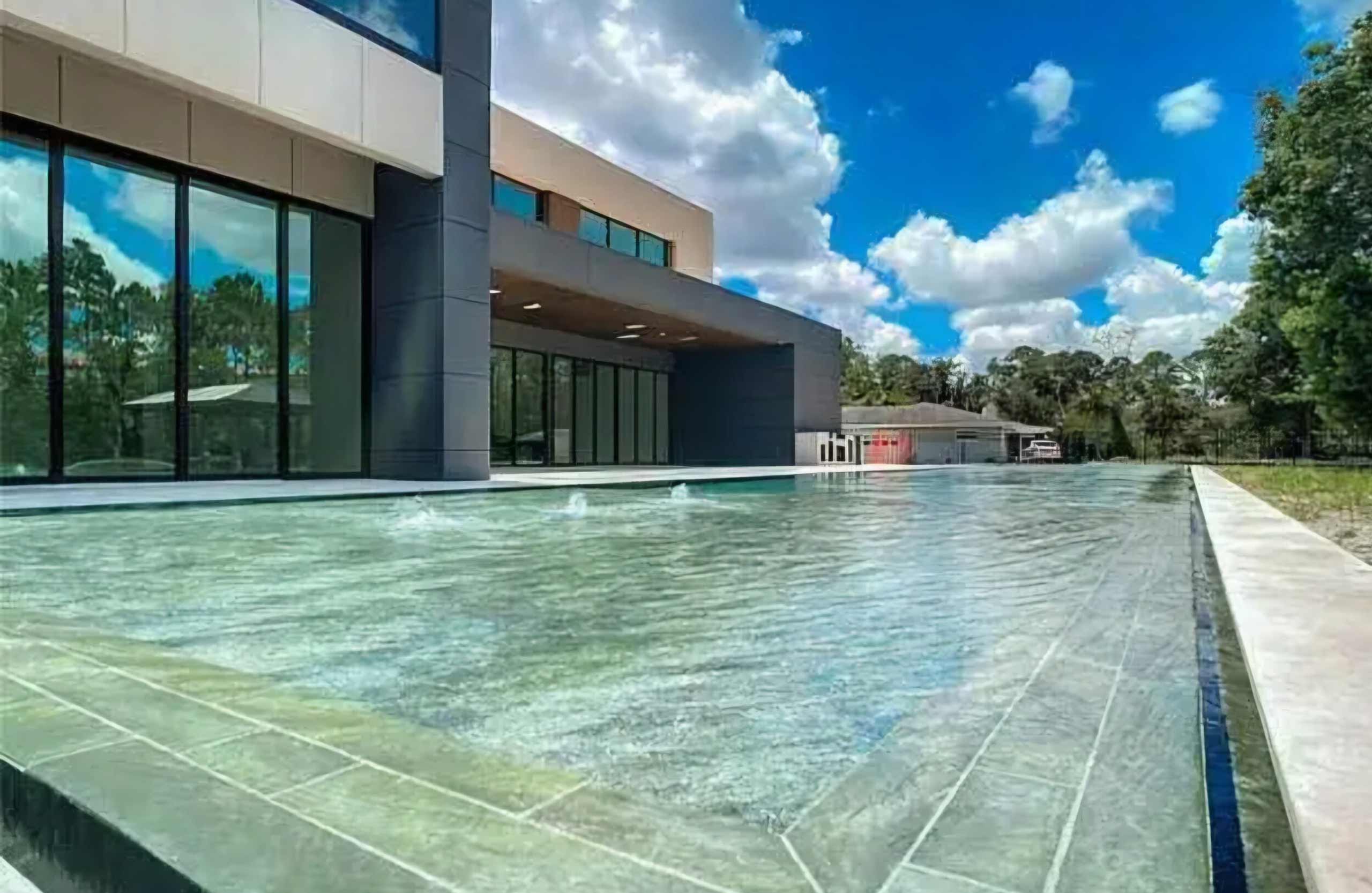Modern home with a long custom swimming pool